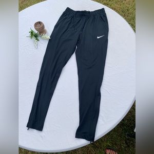 Nike trainer/jogger athletic pants with pockets and drawstring waist.  Size S.